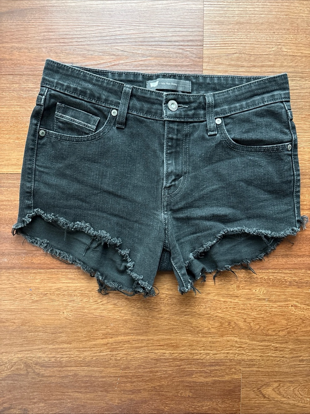 Levi’s Womens Black Denim Cutoff Shorts Size 6 Mid Rise Skinny Raw Hem